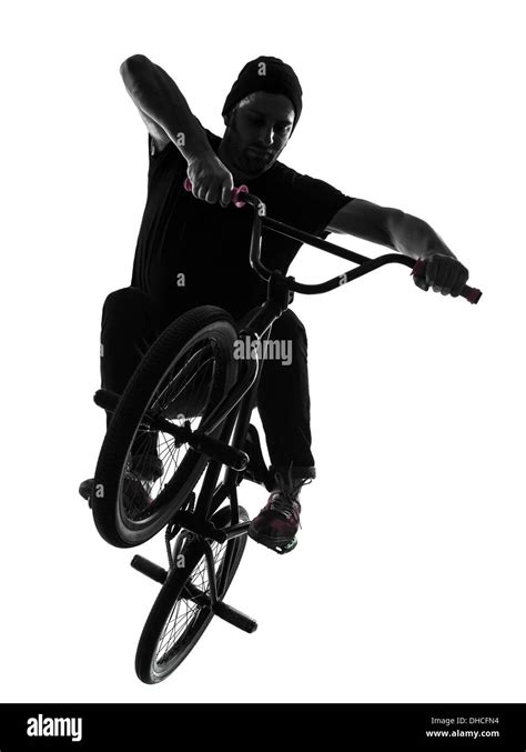 One Man Exercising Bmx Acrobatic Figure In Silhouette Studio Isolated