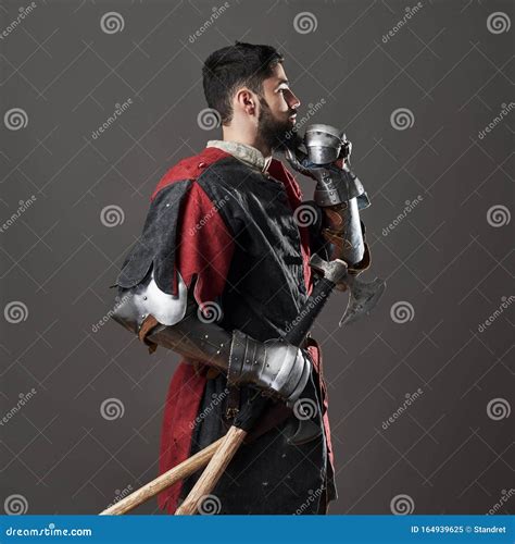 Medieval Knight On Grey Background Portrait Of Brutal Dirty Face