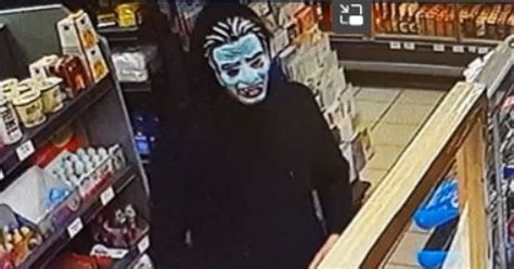 Robber in 'grotesque' Halloween mask threatens female shop worker with ...