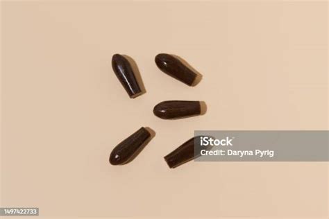 Brown Homeopathic Rectal Suppositories For Reducing Inflammation On A