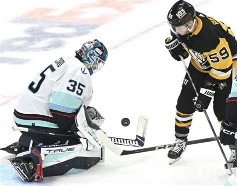 Photo: Seattle Kraken Goalie Makes Save on Pens Jake Guentzel ...