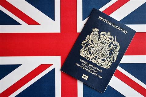 Premium Photo Blue British Passport On National Flag Background Close Up