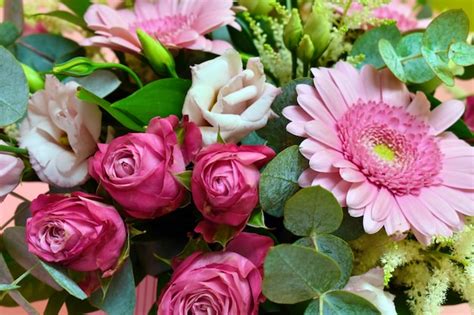 Premium Photo Bouquet Of Pink Flowers And Green Leaves