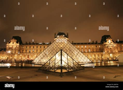 France, Paris - September 24, 2010: Night view of the Louvre, glass ...