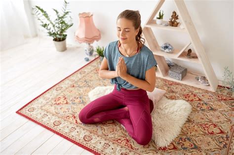 Premium Photo Woman Meditating In Lotus Pose At Yoga Studio