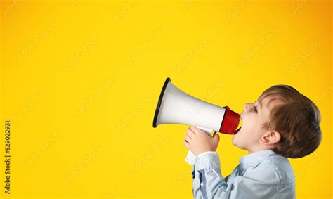 Portrait Of Young Fun Smart Happy Child Hold Megaphone Loudspeaker Back