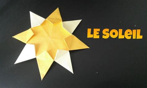 An Origami Star With The Word Le Soleil Written In Yellow On It