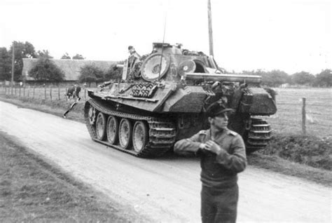 Commander of a Panther tank examining the area. Notice the spare wheel ...