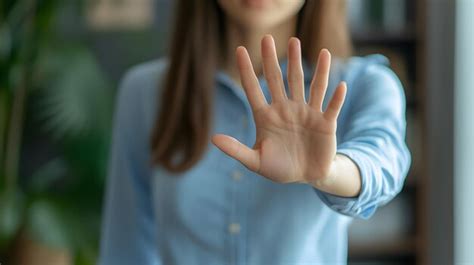 A Woman Making A Stop Hand Sign To Oppose Sexual Harassment And