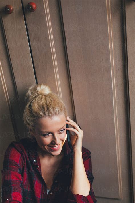 Pretty Blonde Woman Making A Phone Call By Stocksy Contributor