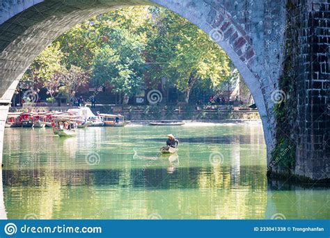 Parked Wooden Tourist Boat On The Tuojiang River In Phoenix Ancient