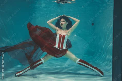 Beautiful Sexy Girl Swimming Underwater In Sporty Style Red And White