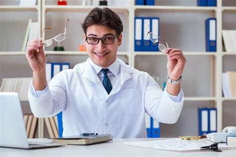 The Doctor Optician Prescribing Holding Optical Glasses Stock Image