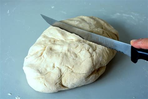 Cutting The Bread Dough With A Knife Stock Photo - Image of bakes, essential: 184040738