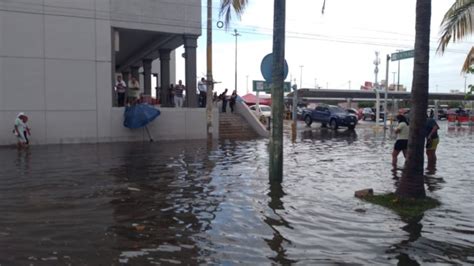 Fuertes lluvias provocan inundaciones en calles de Cancún FOTOS PorEsto