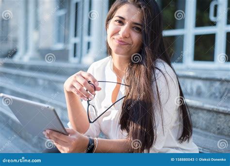 Portrait Of A Beautiful Indian Girl Business Woman Smiling Holding