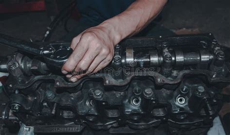 Caucasian Hands Of A Mechanic Is Checking The Engine Stock Photo