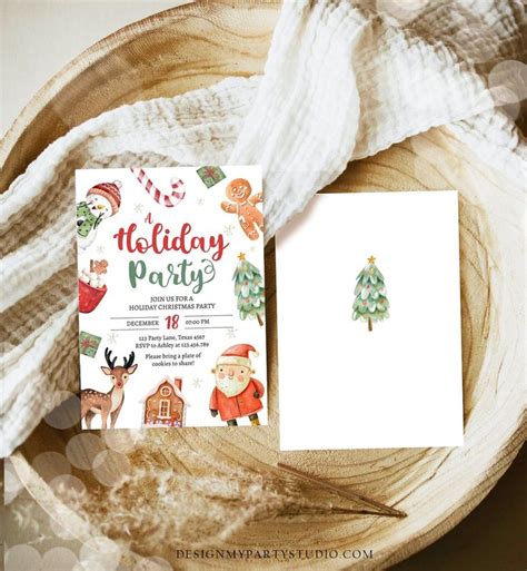 the holiday party is set up on top of a wooden plate with white paper ...