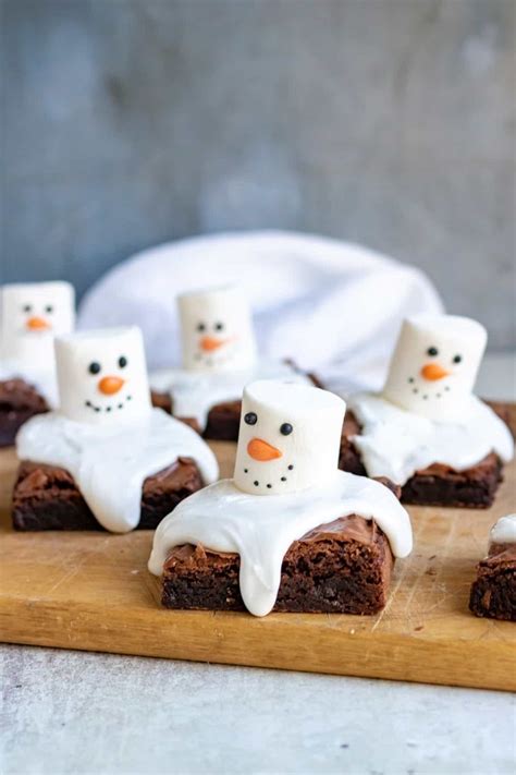 Chocolate Brownies With Marshmallows And Frosting In The Shape Of Snowmen