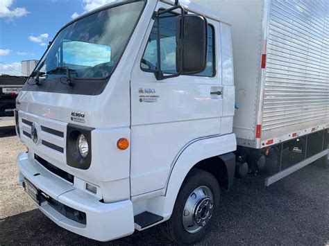 A White Truck Parked In A Parking Lot