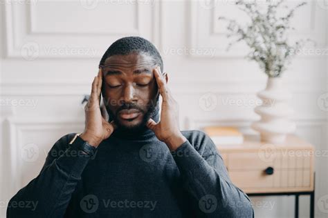 Stressed young african man employee with frustrated face expression ...