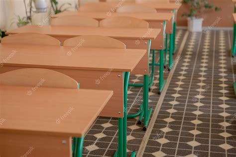 Premium Photo Interior Of Empty Classroom With Chairs And Desks In A Row