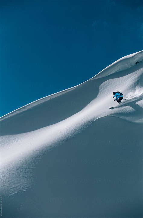 Male Skier Freeriding Steep Powder Slope In The Mountains Of Austria