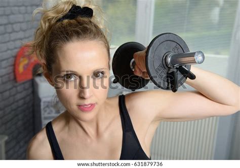 Pretty Blonde Fitness Woman Lifting Dumbbells Stock Photo 631879736