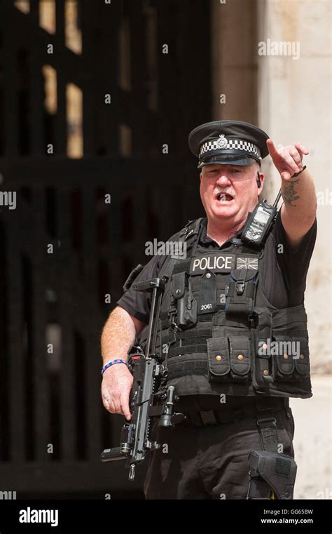 An Armed Police Officer On Duty In Central London As Scotland Yard