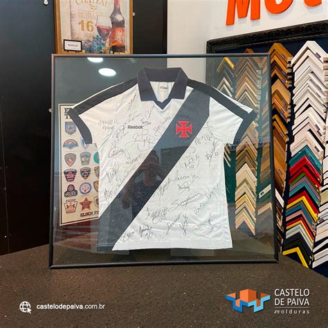 A Display Case With An Autographed Shirt In It