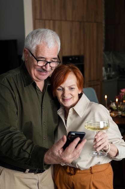 Free Photo Medium Shot Senior Couple Taking Selfie