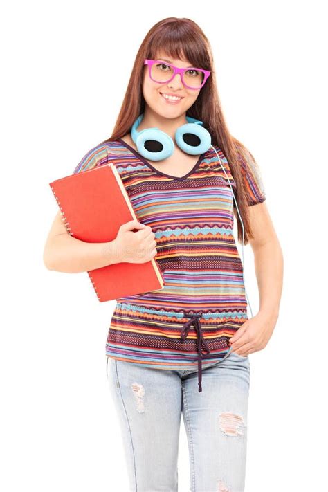 Estudante Os Fones De Ouvido Que Guardam Um Caderno Foto De Stock