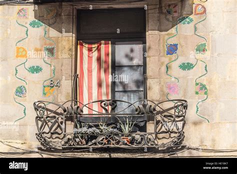 A Balcony In Barcelona Spain With The Catalonian Flag Displayed