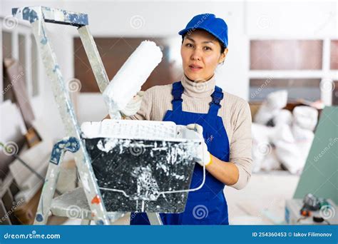 Portrait Of Woman Painter In Apartment During Repair Works Stock Image