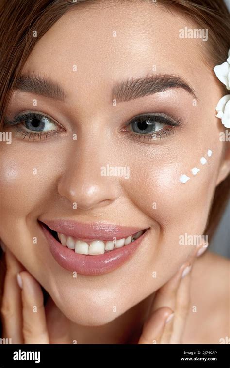 Beauty Woman About To Apply Face Cream Holding Moisturizing Lotion