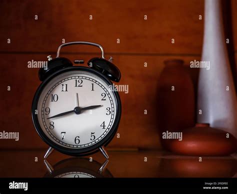 black vintage or retro alarm clock Stock Photo - Alamy