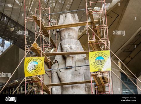 Egyptian Workers Restore A Giant Granite Statue Of The Ancient Egyptian