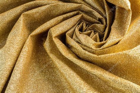 Golden shiny fabric texture Stock Photo by ©whyframeshot 126342026