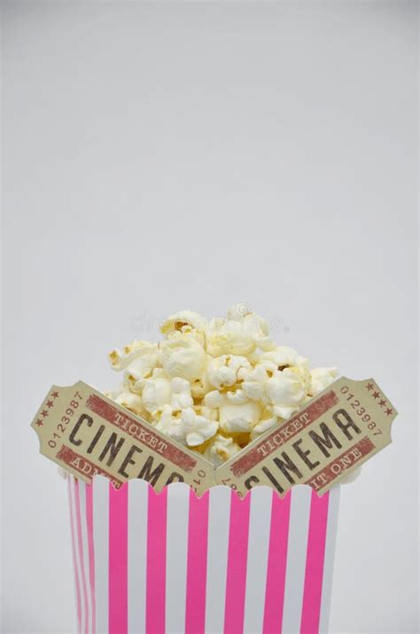 Pink Striped Box of Popcorn with Two Cinema Tickets Inside Stock Photo ...