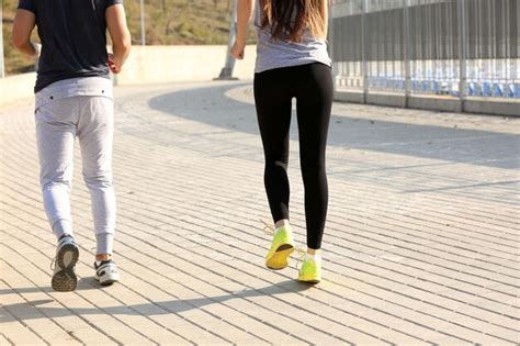 Premium Photo | Young people jogging at park