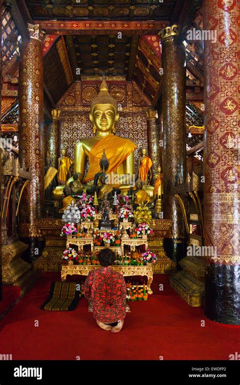 BODHI GARRETT Prays To A BUDDHA STATUE Inside WAT XIENG THONG Temple