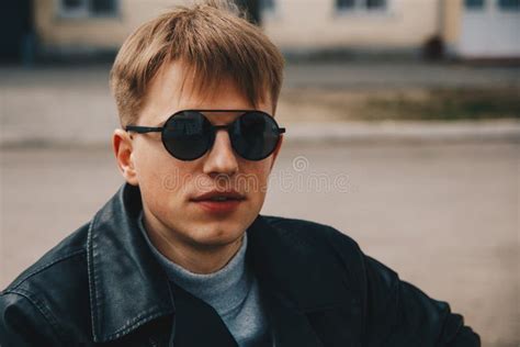 Portrait of a Guy in Round Sunglasses and Leather Jacket Stock Image ...