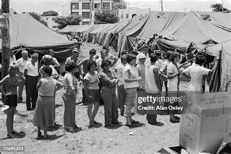 Cuban refugees from the Mariel Boatlift line up for medicines at an ...