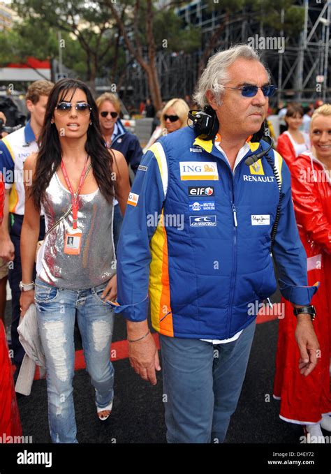 Renault F1 Team principal Flavio Briatore (R) and his girlfriend ...