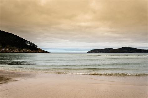 Premium Photo Sunset Views Of A Quiet Beach In Galicia