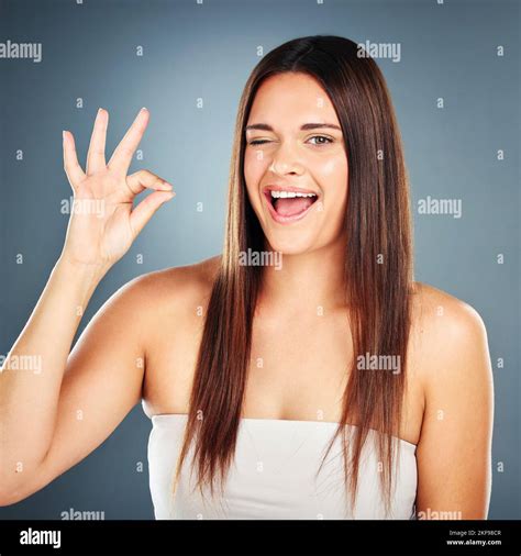 Ok Hand Sign Woman And Happy For Success With Face Wink Or Advertising