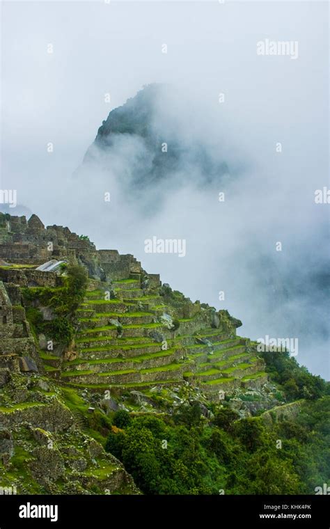 Machu Picchu Peru Storm Clouds And Mist Ancient Inca Ruins Stock