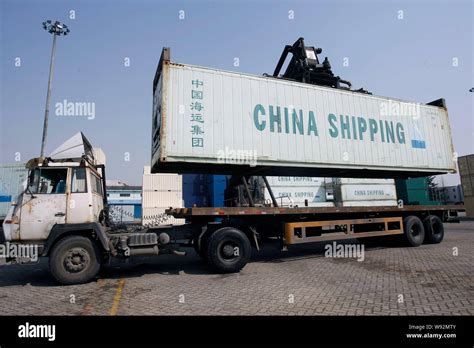 --FILE--A truck carriying a shipping container is seen at the storage ...