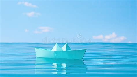 An Origami Paper Boat With Two Decks Floating On Calm Water Stock