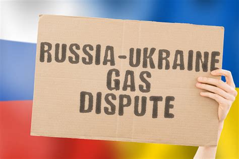 The Phrase Russiaukraine Gas Dispute On A Banner In Mens Hand With ...